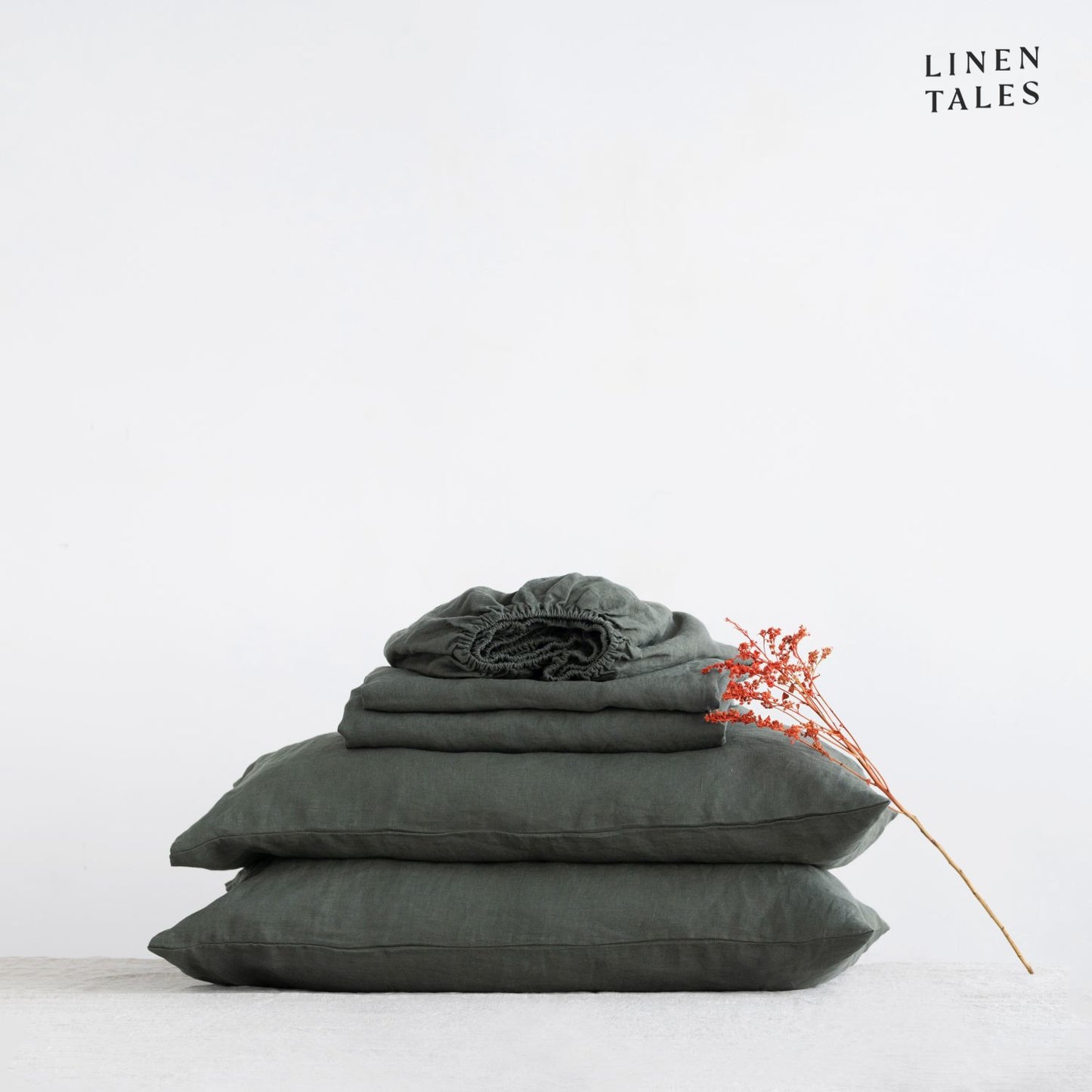 Pure European Linen Sheet Set in Forest Green displayed on a neatly made bed – includes a flat sheet, fitted sheet, and matching pillowcase for effortless comfort.