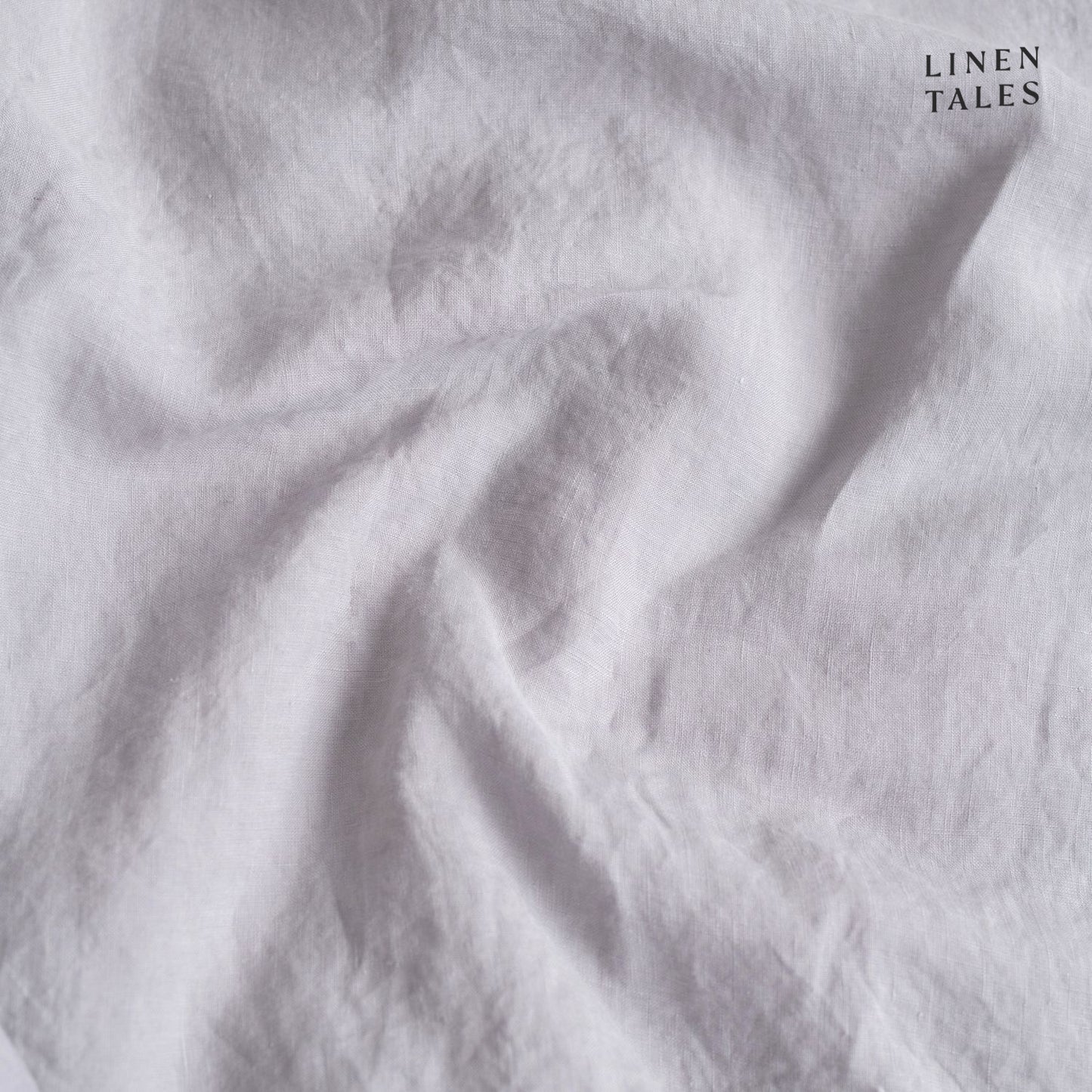 Close-up of Light Grey linen duvet cover opening, featuring natural wooden buttons for a refined and functional finish.