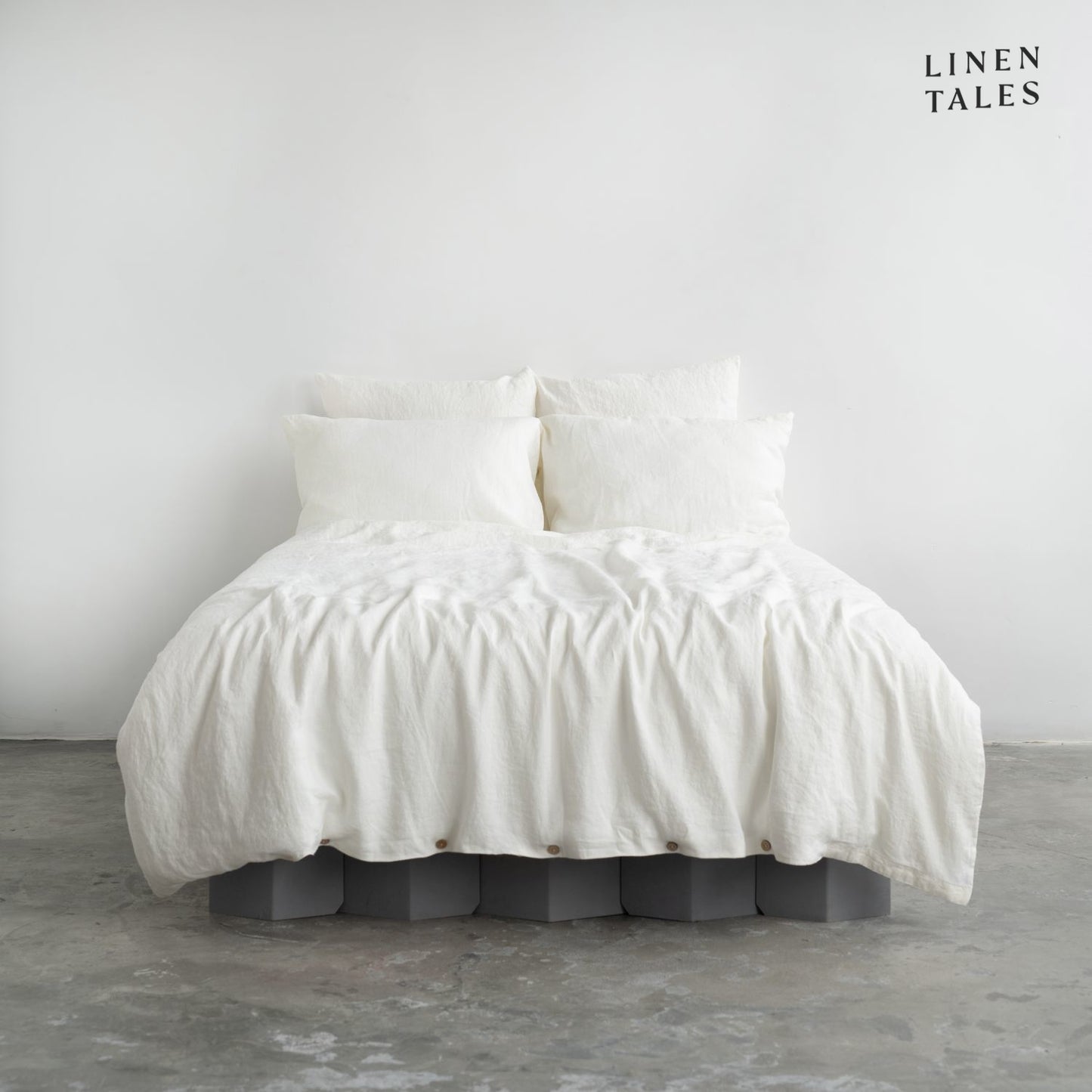 Premium White linen duvet set with matching pillowcases, elegantly styled for a soft and breathable sleep experience.