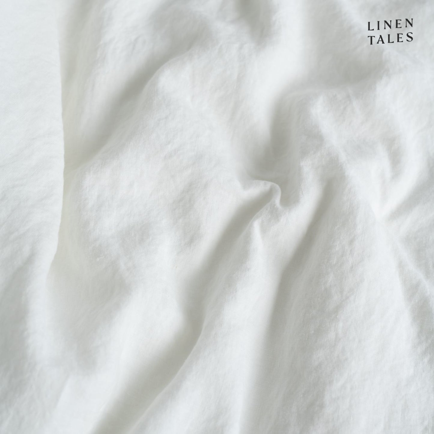 Textured close-up of White linen fabric, showcasing natural fibers, softness, and breathable weave.