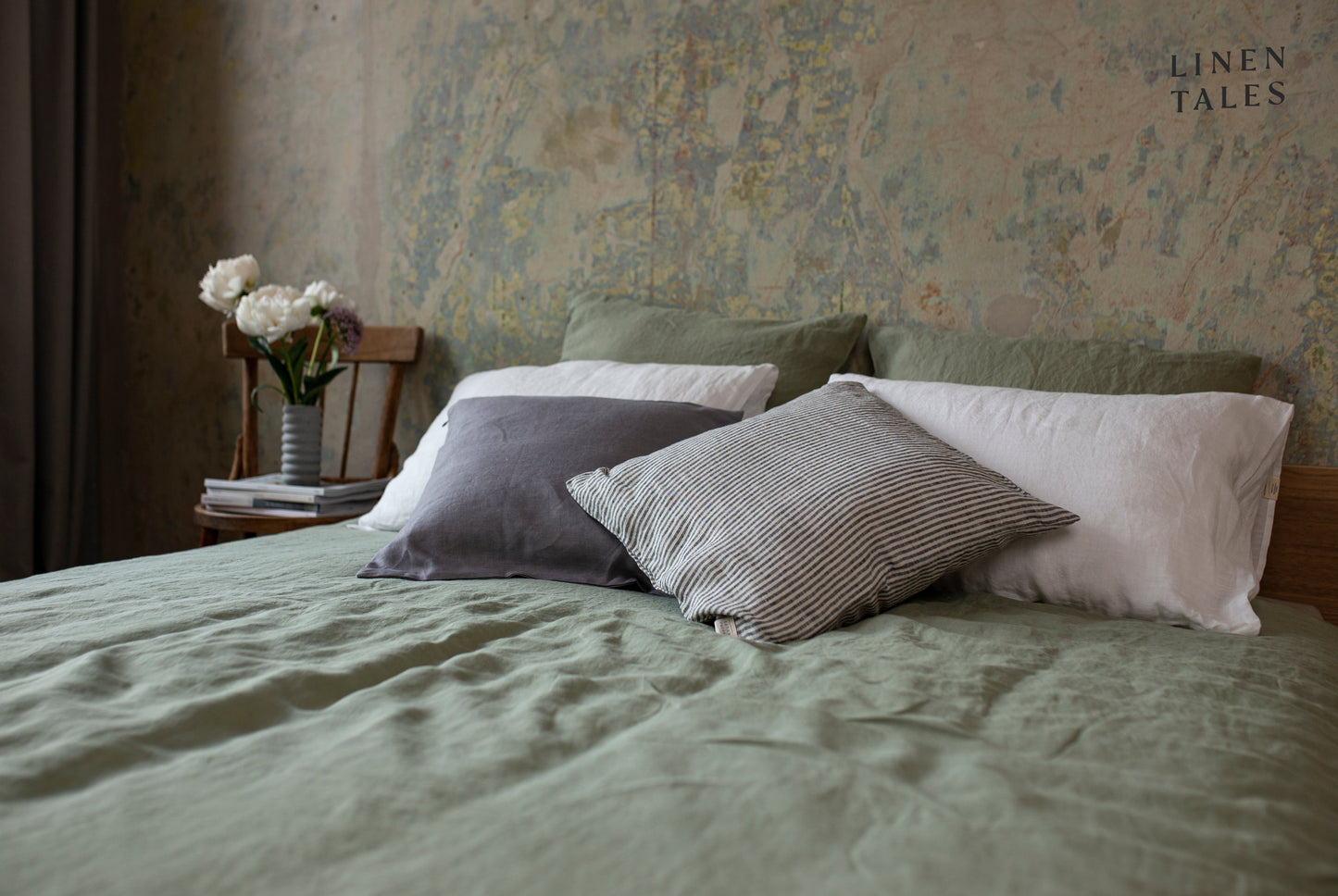 Green linen bed styled by Linen Bay, featuring breathable 100% flax linen crafted for timeless comfort and natural elegance