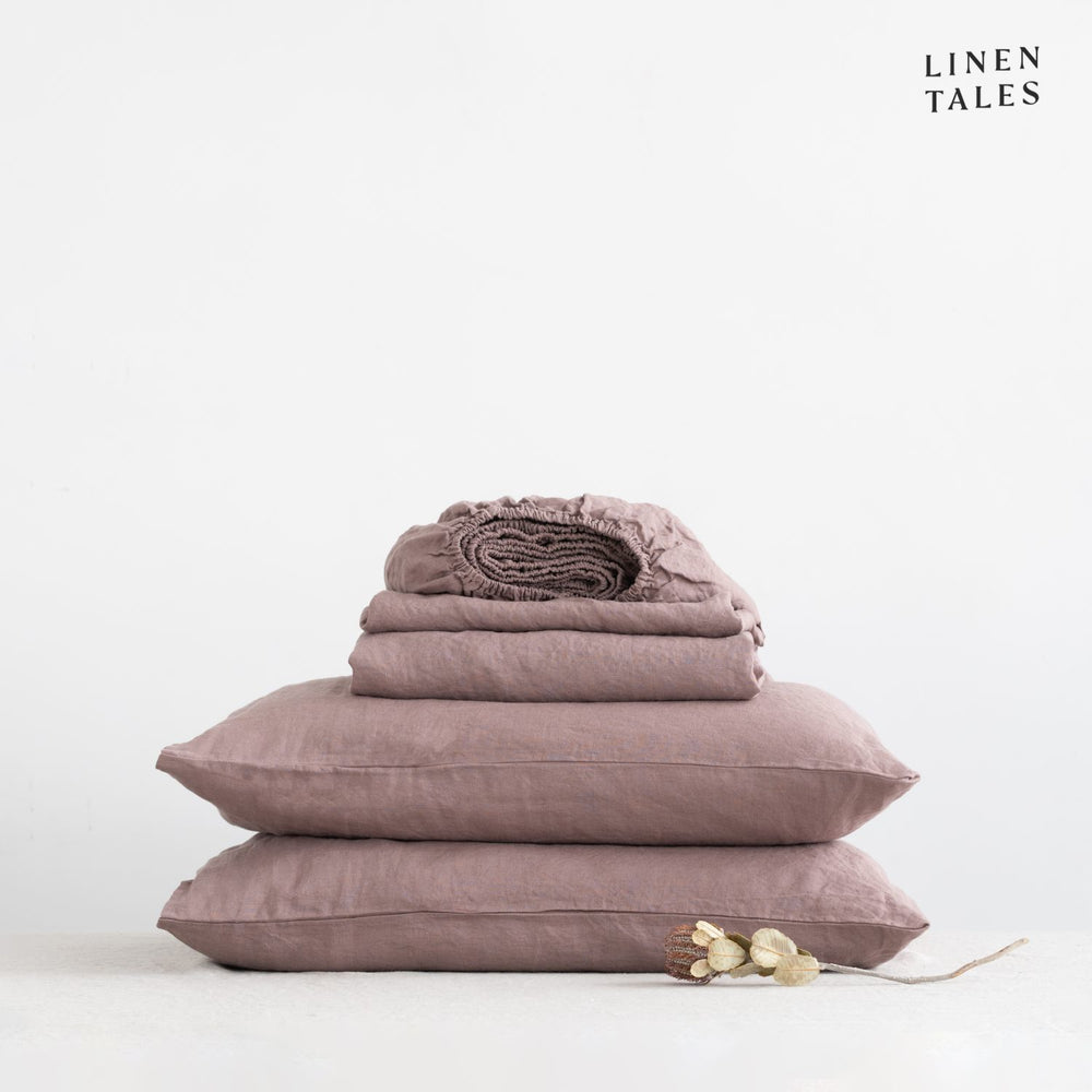 Imagine these beautifully draped linen sheets in Ashes of Roses with matching pillowcase, styled on a bed – crafted for comfort, elegance, and natural breathability.