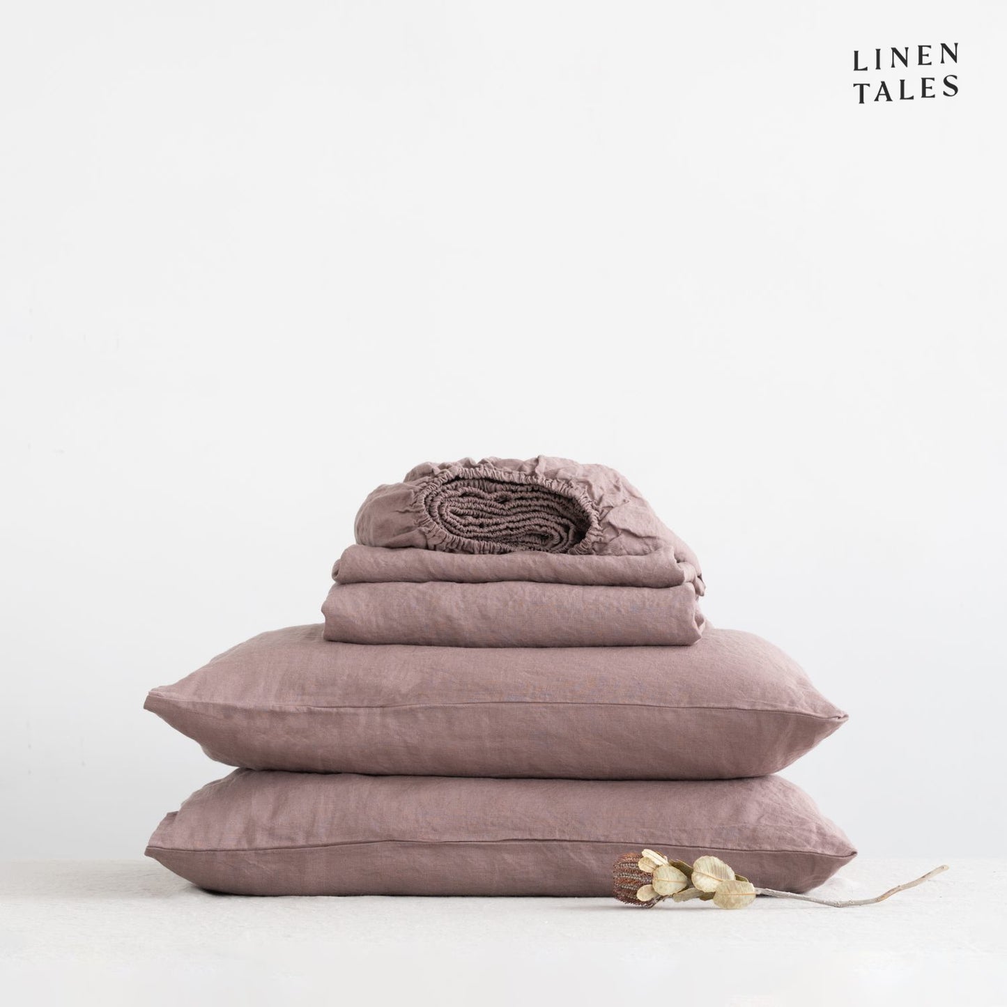 Imagine these beautifully draped linen sheets in Ashes of Roses with matching pillowcase, styled on a bed – crafted for comfort, elegance, and natural breathability.