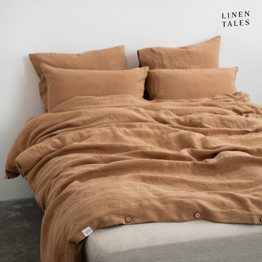 
                  
                    Softly ruffled Camel linen duvet cover and pillowcase, highlighting relaxed elegance and breathable fabric.  
                  
                
