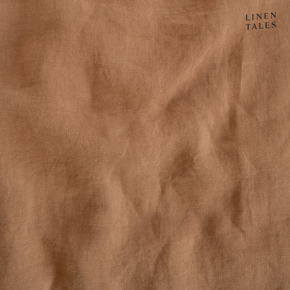 
                  
                    Textured close-up of Camel linen fabric, showcasing natural fibers, softness, and breathable weave. 
                  
                