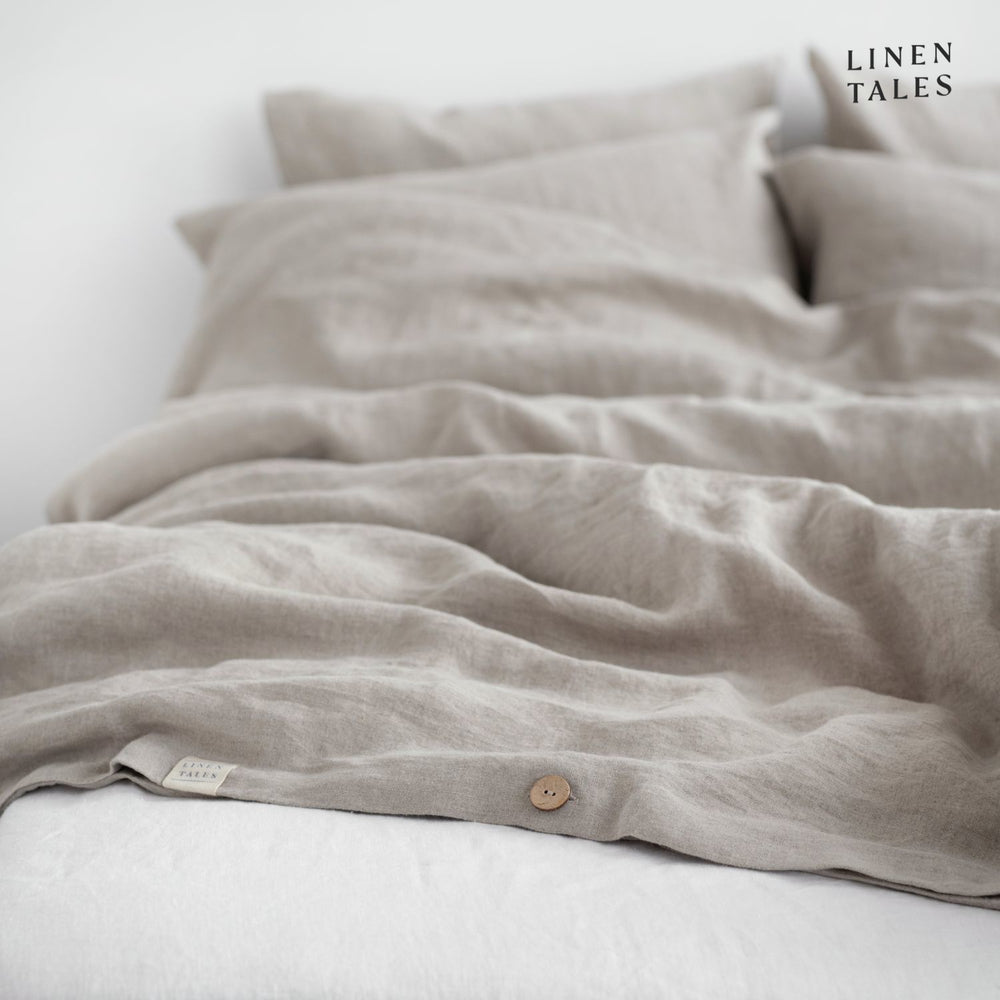 
                  
                    Fine edge stitching and branded Linen Tales tag on Natural linen duvet cover, showcasing craftsmanship and premium quality.
                  
                