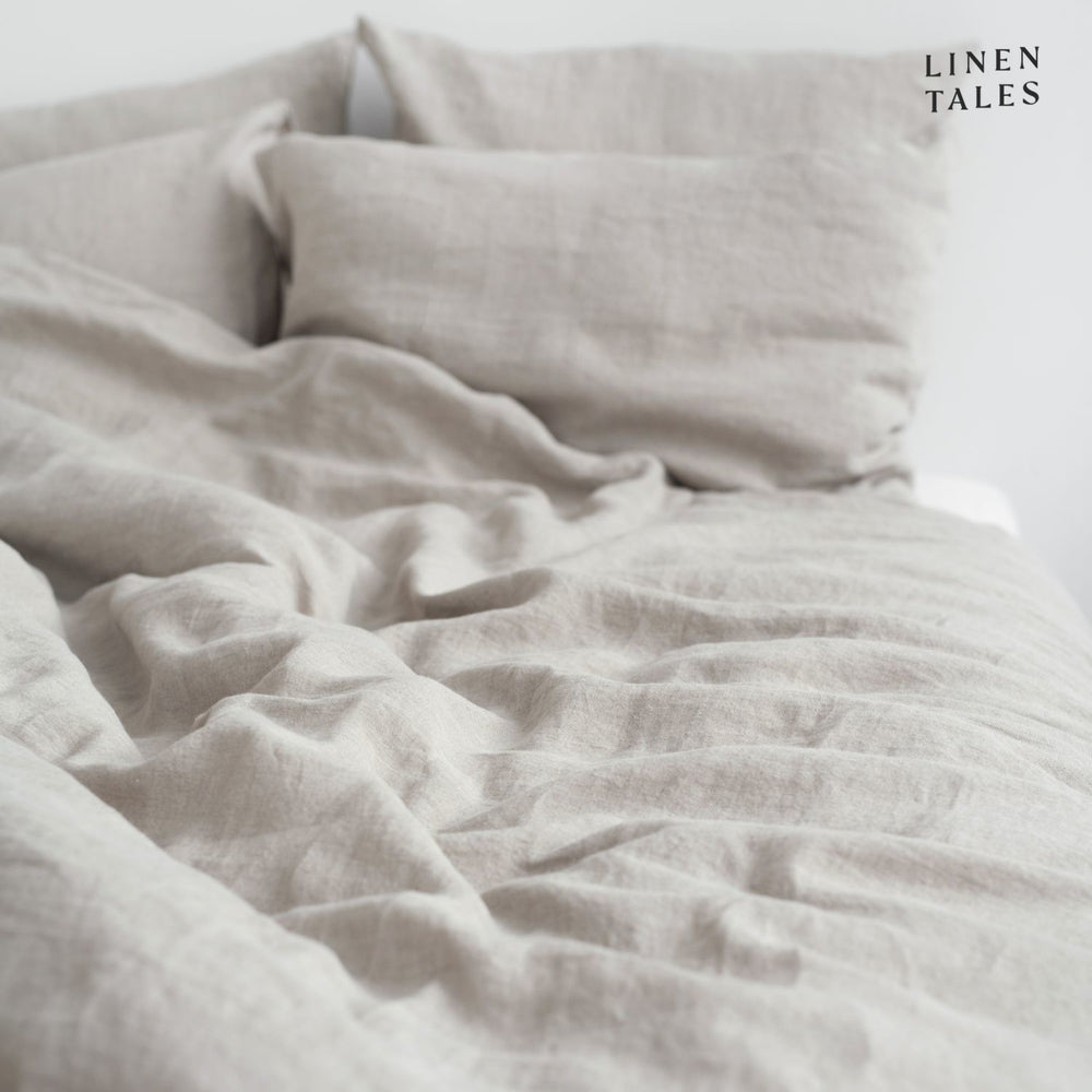 
                  
                    Softly ruffled Natural linen duvet cover and pillowcase, highlighting relaxed elegance and breathable fabric.  
                  
                
