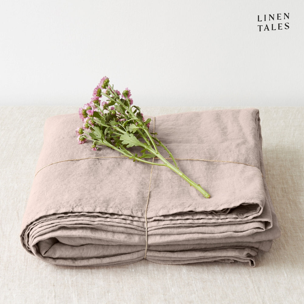 A folded fitted 100% pure linen flat sheet in earthy portobello brown, reflecting natural richness and depth.