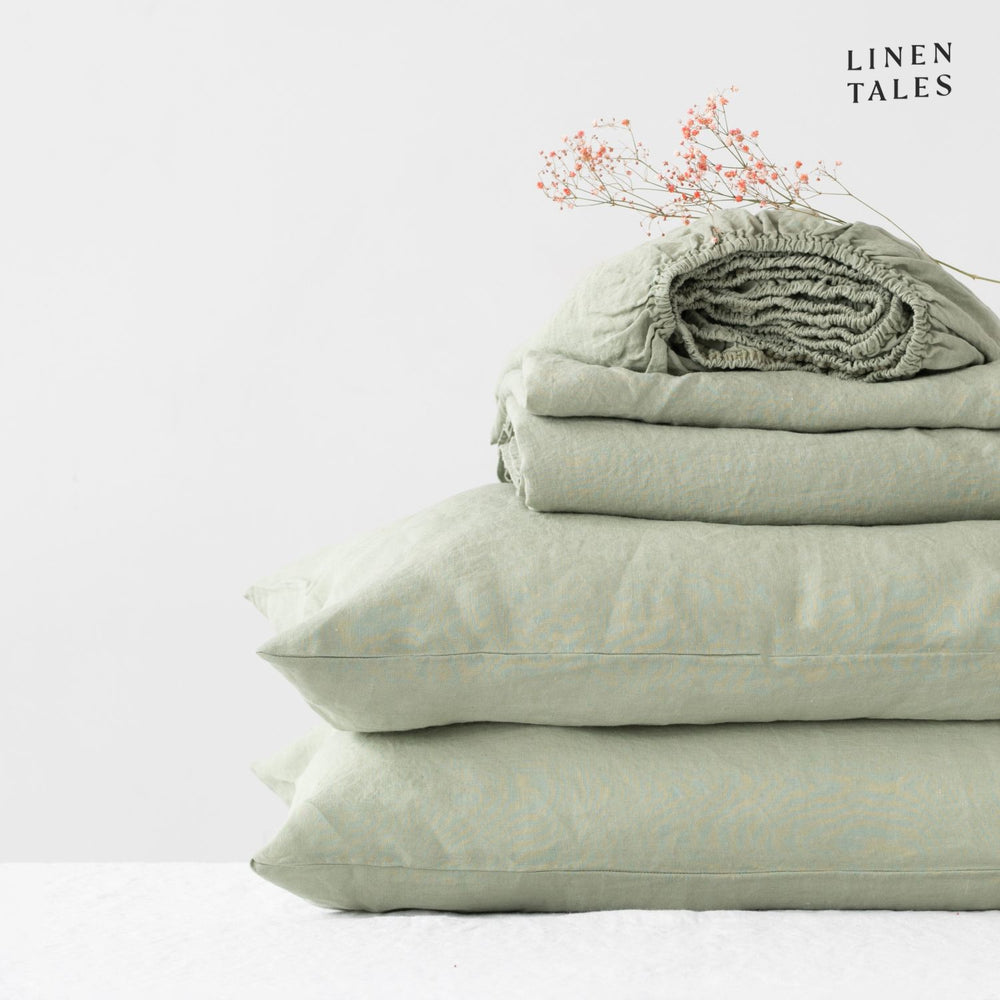 
                  
                    Minimalist bedroom featuring pure linen bed sheets in Sage with a matching pillowcase – refined simplicity meets luxurious softness
                  
                