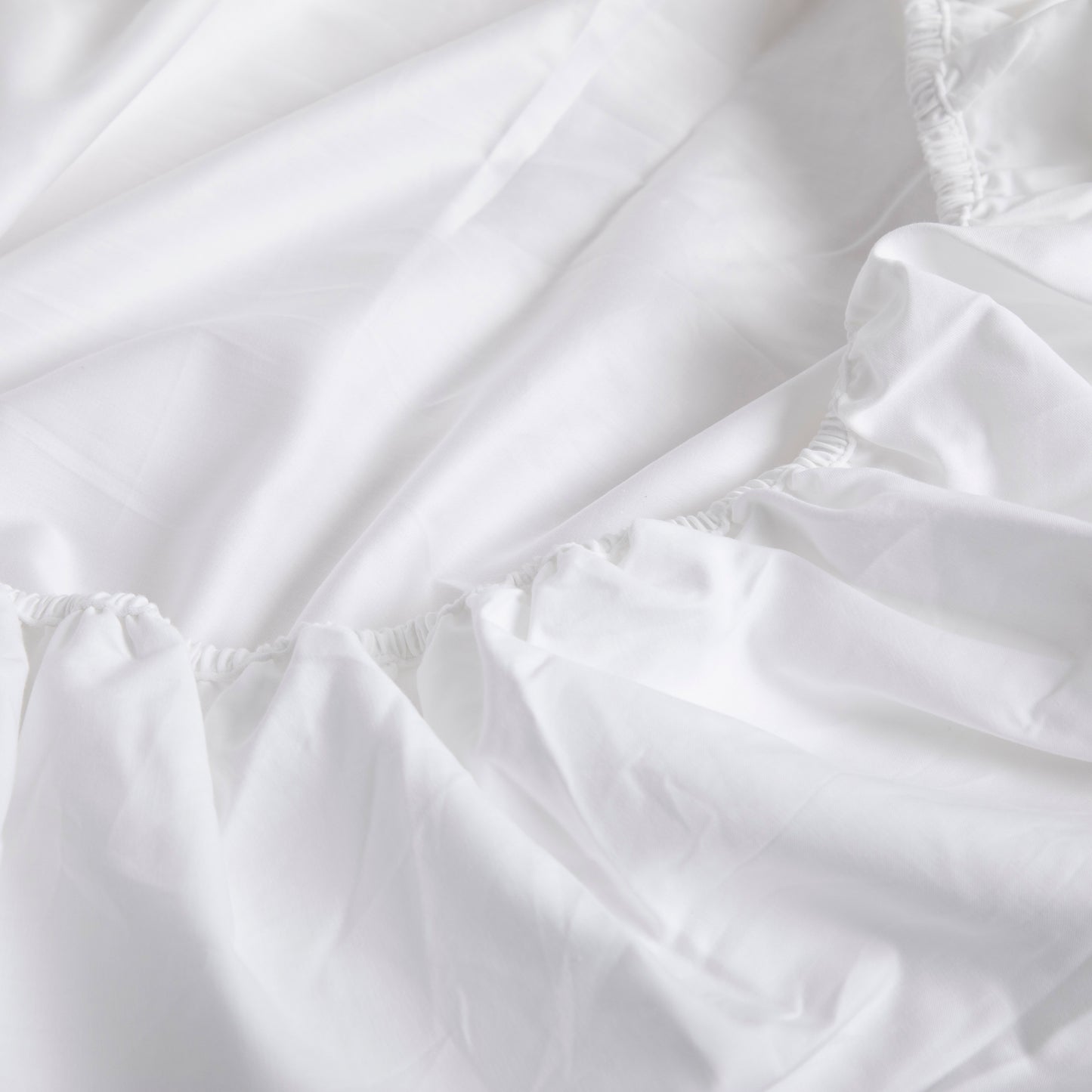 Close-up of white fabric with ruffled edges