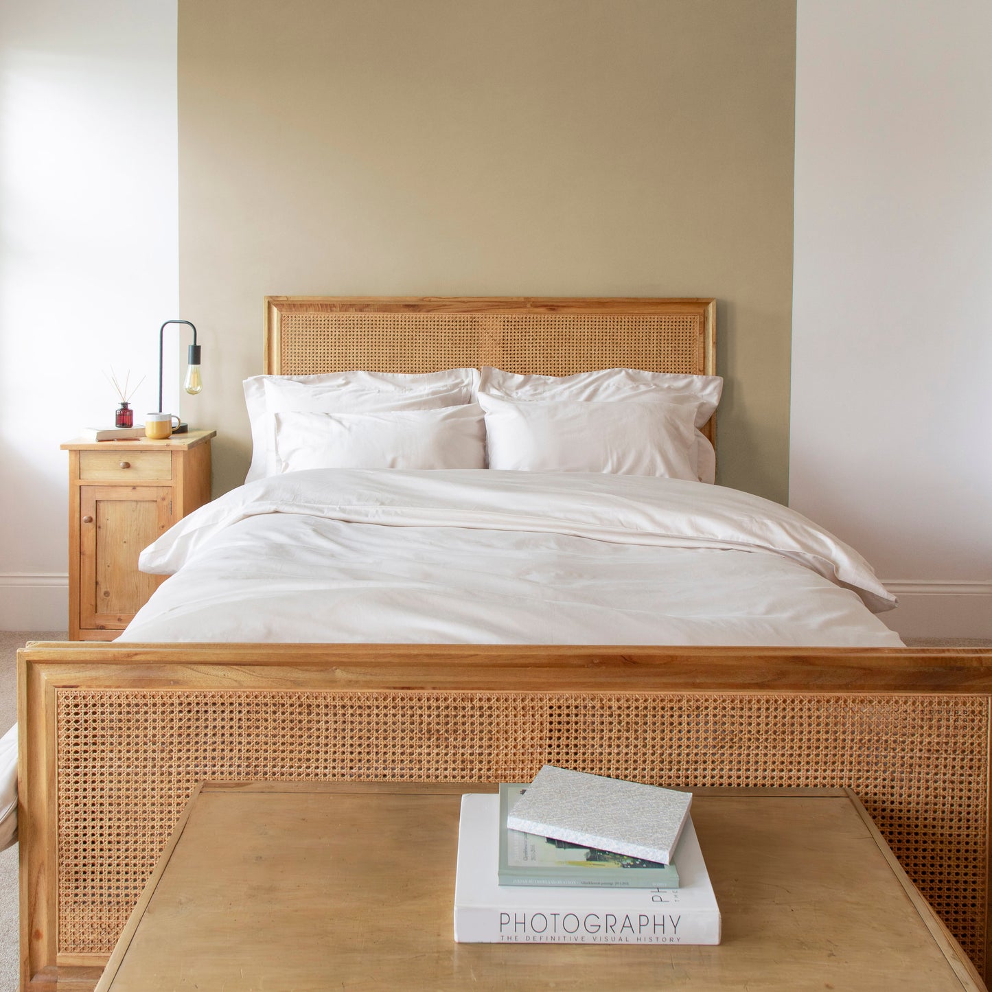 Bedroom with wooden bed frame, driftwood bedding, and a side table – Linen Bay UK